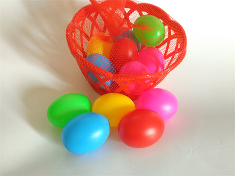 Basket of colored eggs (12 grains), toys, kitchenware