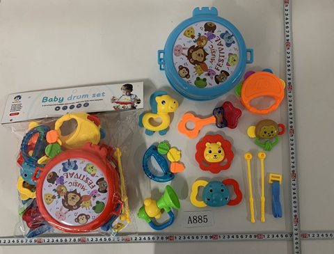 The baby rings the bell and beats the drum