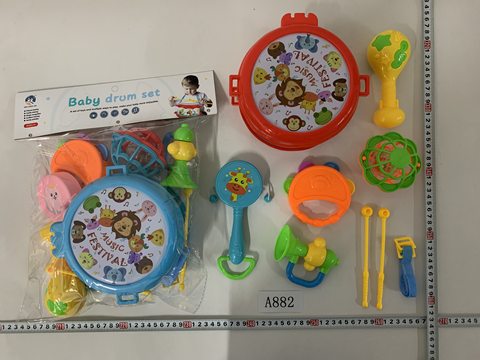 The baby rings the bell and beats the drum