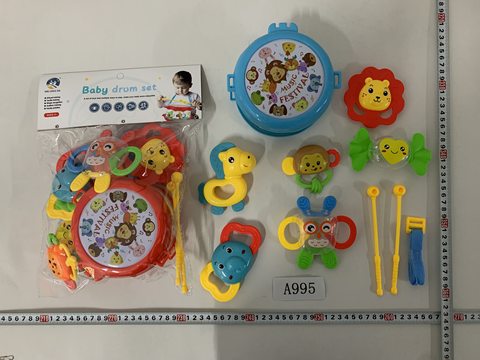 The baby rings the bell and beats the drum