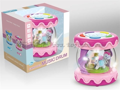 Baby spins, patting small drums with lights and music (powder)