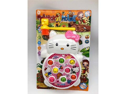 Kitten whacking a mole electric toy